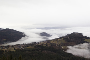 Alpine village in the fog. France, rhone-Alpes