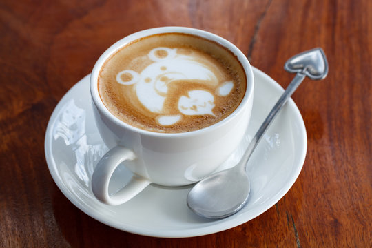A cup of latte art coffee like face bear