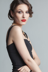 Fototapeta premium Portrait of beautiful woman with make-up and hairstyle.