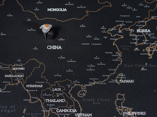 Top view of miniature business man on map of China, Business Trip Concept