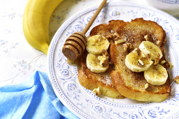 French toasts with banana,walnuts and cinnamon.