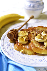 French toasts with banana,walnuts and cinnamon.