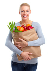 Beautiful woman holding shopping bag with food.