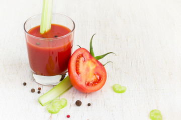 Fresh tomato juice, celery and half a tomato, space for text