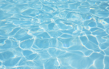 Fresh water in swimming-pool. Aqua texture.