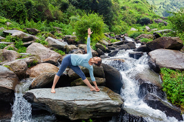 Woman doing Ashtanga Vinyasa yoga asana  outdoors