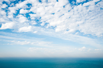 Naklejka na ściany i meble blue sea and clouds on sky