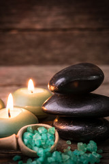 Fototapeta na wymiar spa concept with stone and candles on wooden table ,