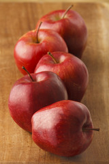 Five Apples on a Cutting Board