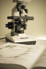 Microscope on table for vintage science background