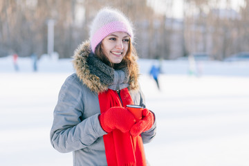 Woman holding winter cup close up