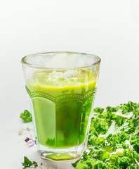 Close up of green smoothie glass, side view.  Healthy lifestyle or detox  diet food concept.