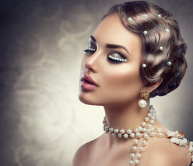 Retro styled makeup with pearls. Beautiful Young woman portrait 