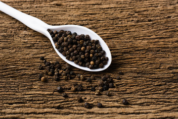Colorful spices in plastic spoons - black pepper, Thailand's aro
