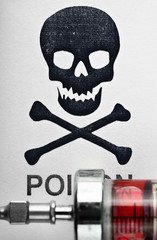Skull and crossbones on a syringe with medicine