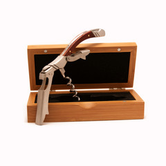 Wine bottle opener with wooden case. Isolated