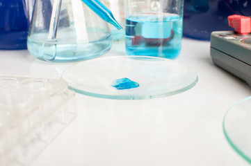 science laboratory test tubes with periodic table background