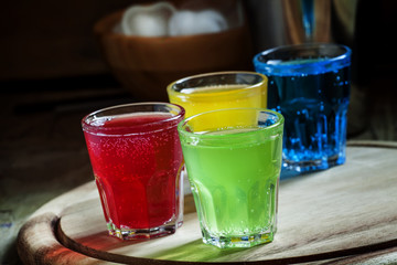 Multi-colored festive alcoholic cocktails, selective focus