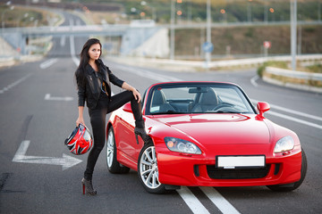 Obraz na płótnie Canvas girl near red car