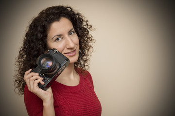 Obraz premium Woman Posing With Slr Camera