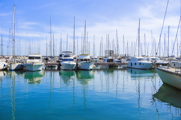 Fototapeta na wymiar Stock Photo beauty Harbor Yacht Club with glazed clear sea and blue clouds