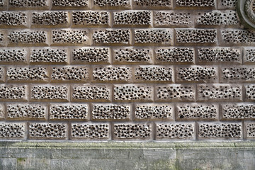 Sandstone wall bricks with a sponge-like texture