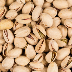 Fototapeta premium Pistachio nuts arranges as background