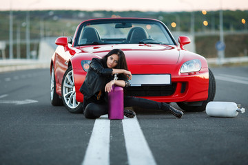 girl near red car