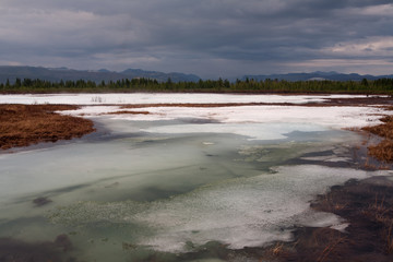 Remnants of ice in the river valley. Moma River. Yakutia. Russia.