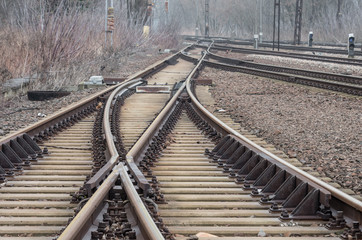 Fototapeta na wymiar Railway track on gravel embankment, with concrete railway ties