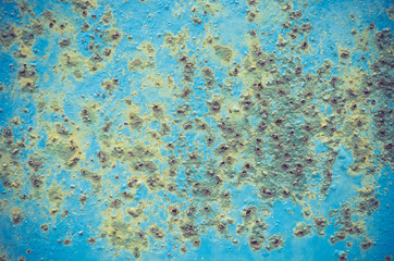 old blue painted steel plate with rust