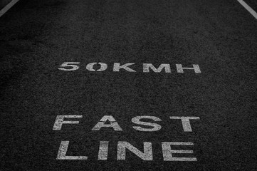 Speed limit written on the asphalt