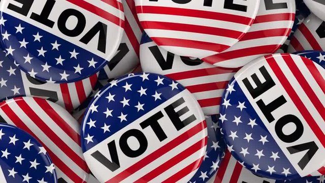 Lateral dolly shot of vote buttons in a box. Presidential or political election theme.