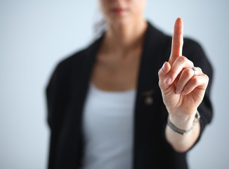 Woman touching an imaginary screen with her finger 