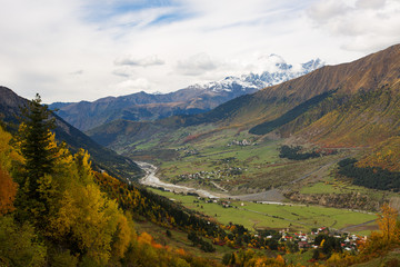 Naklejka premium Autumn in the Caucasus mountains. Mount Ushba. Svaneti, Georgia