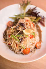 Papaya salad with rice noodle.