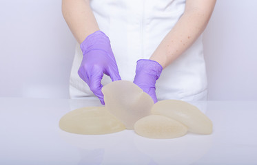 Silicone breast implant. Plastic surgery concept. Aesthetic surgery concept