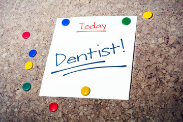 Dentist Reminder For Today On Paper Pinned On Cork Board