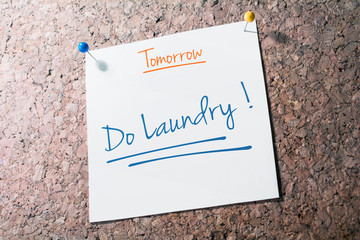 Do Laundry Reminder For Tomorrow On Paper Pinned On Cork Board