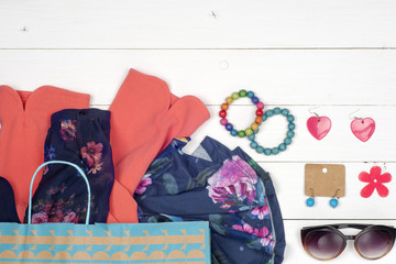 Voyage concept - set of woman stuff on wooden background