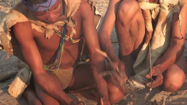 Bushmen making a fire in the traditional way