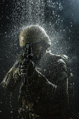 Obraz na płótnie Canvas US Army soldier in the rain