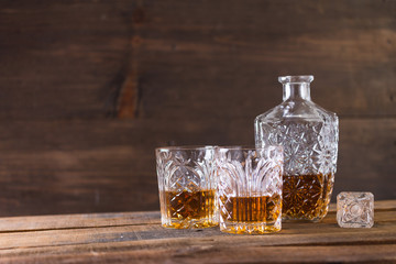 whiskey in glass on wood background