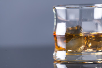 whiskey on the rocks on glass table