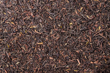 Background of dry black tea with flavors