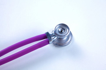 Fototapeta na wymiar Stethoscope on white table with shallow depth of field for medical college concept