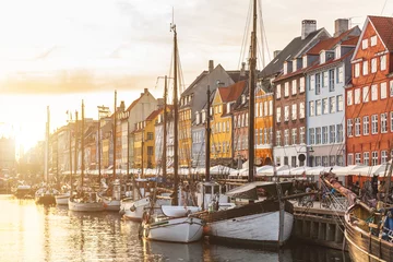 Photo sur Plexiglas Scandinavie Maisons colorées dans la vieille ville de Copenhague au coucher du soleil