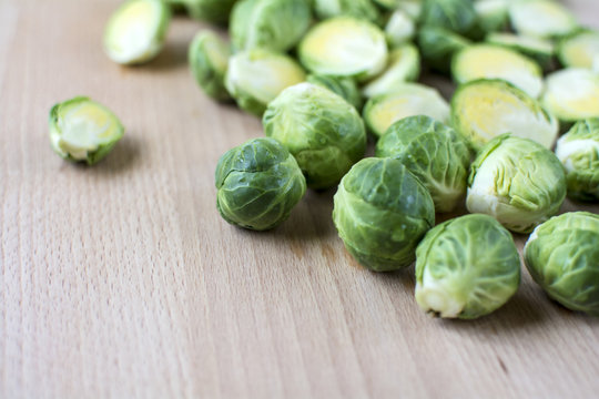 Cut  Brussels Sprout Lay Flat On Wooden Board