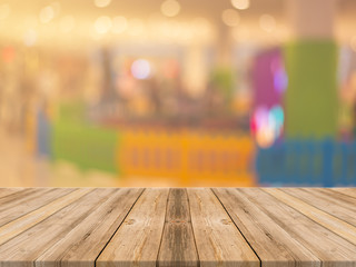 Wooden board empty table in front of blurred background. Perspective brown wood over blur in coffee shop - can be used for display or montage your products.Mock up for display of product.