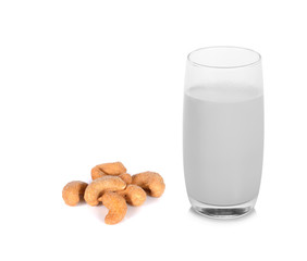 warm milk with cashew nut on white background